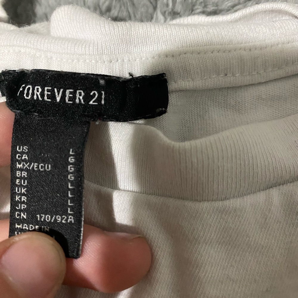 Size large forever 21 shirt. Reads “careful with my heart”